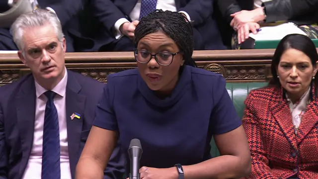 Kemi Badenoch asking questions in the House of Commons, Dame Priti Patel and James Cartlidge are sat behind her