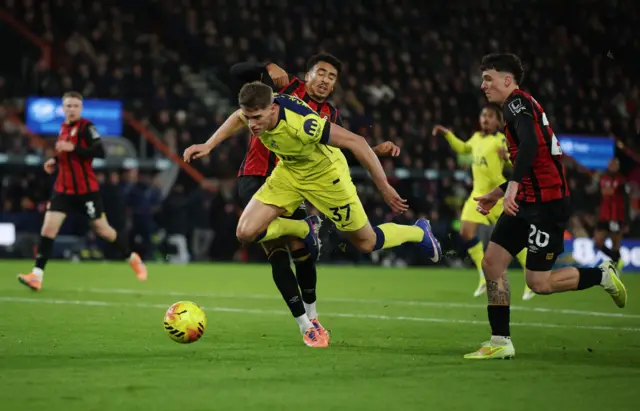 AFC Bournemouth's James Hill fouls Tottenham Hotspur's Micky van de Ven to concede a penalty