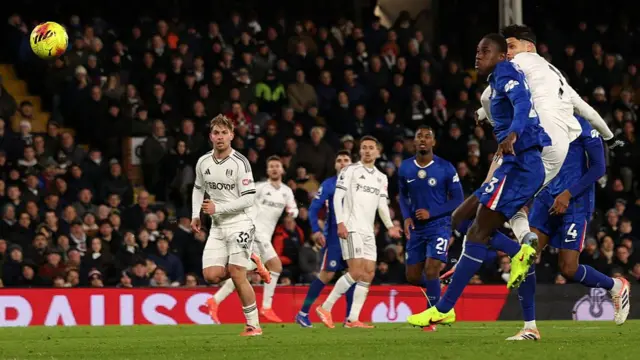 Raul Jimenez (right) beats Chelsea's Trevoh Chalobah to score