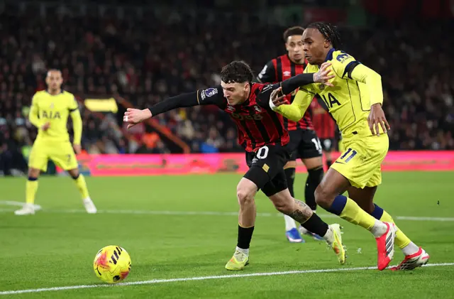 Alex Jimenez of AFC Bournemouth is challenged by Mathys Tel of Tottenham Hotspur