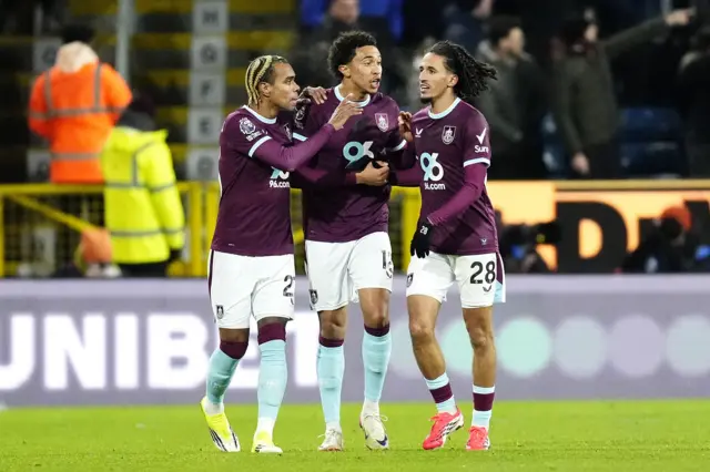 Burnley's Bashir Humphreys (centre) celebrates with team-mates a