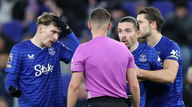 Everton's Jack Grealish appeals to referee Thomas Kirk after receiving a red card