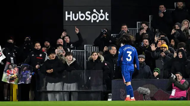 Marc Cucurella of Chelsea walks to the tunnel after being shown a red card