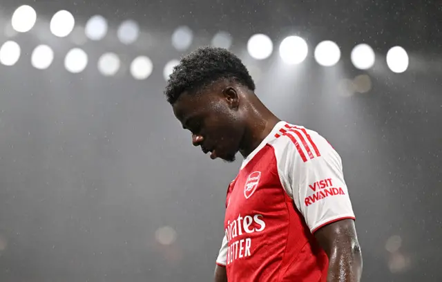 Bukayo Saka of Arsenal looks on