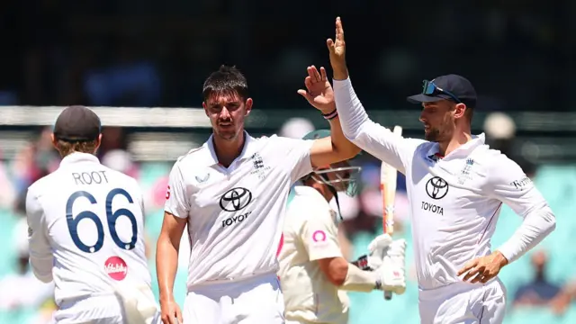 Josh Tongue of England celebrates after taking the wicket of Travis head