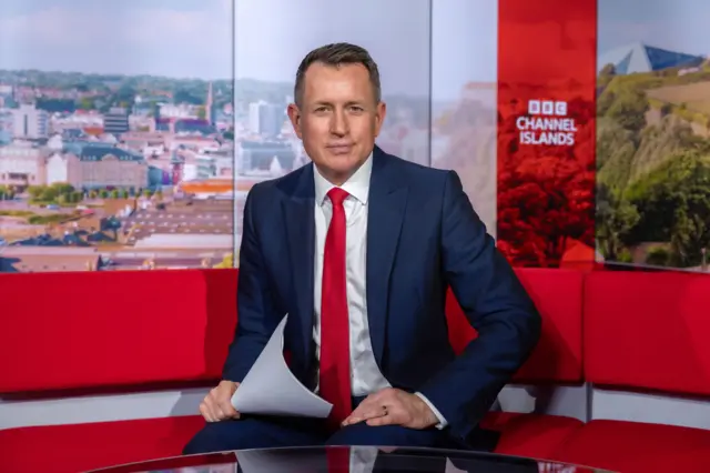 Charlie McArdle on the tv studio set at BBC Channel Islands, St Helier, Jersey