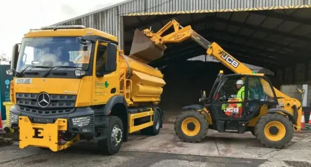Gritters in Devon with people filling up truck