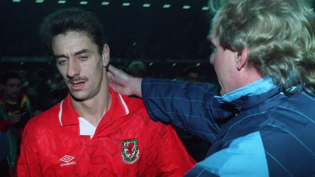 Terry Yorath (right) consoles Ian Rush after Wales lose to Romania in 1993