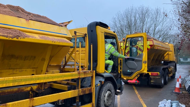 Gritting lorries preparing to leave a depot