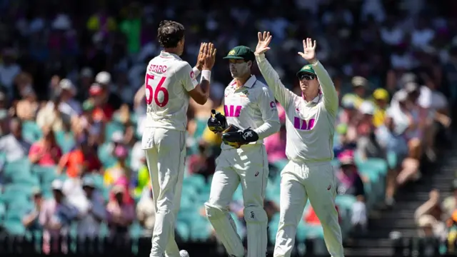 Mitch Starc of Australia is congratulated