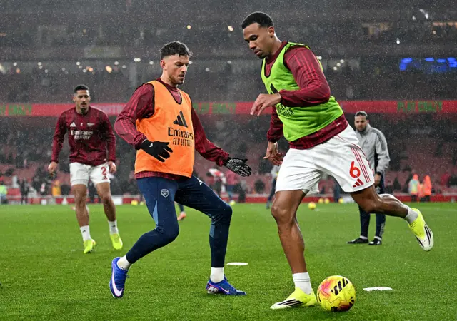 en White and Gabriel of Arsenal warm up