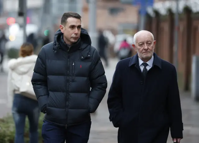 David Coote (left) arrives at court ahead of the sentencing this morning