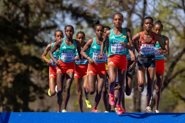 Marta Alemayo of Ethiopia and athletes compete at the Women's U20 Final at the World Athletics Cross Country finals Championships