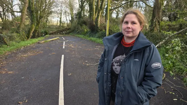 Storm Roe stood on the right looking at the camera.