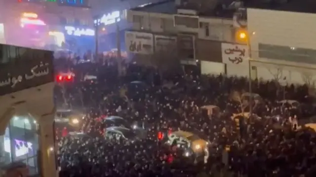 People gather on the streets amid anti-government unrest in Tehran, Iran, in this still image obtained from social media video released on January 8, 2026
