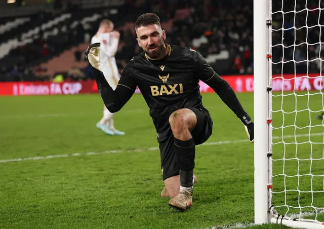 Matt Ingram reacts to making a save in the shootout