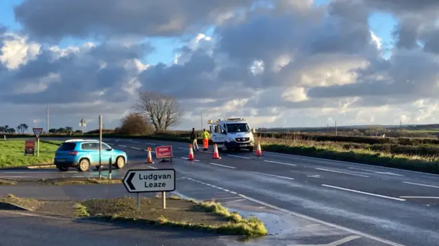 Van and car at road junction