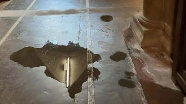 Water on floor of cathedral