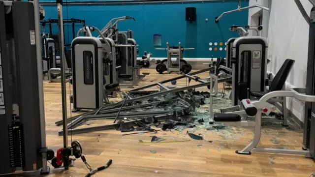 Smashed gym equipment and glass at a Jersey sports centre