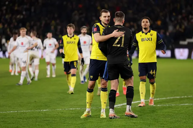 Oxford players celebrate their win at full time
