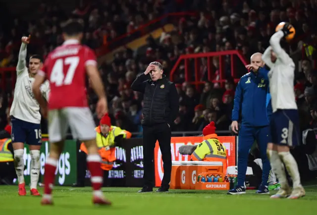 Parkinson puts his hand to his head after the late equaliser