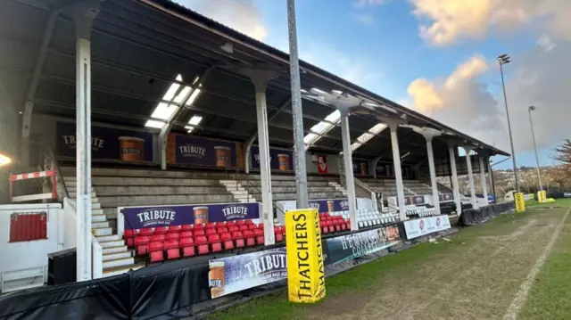 Grandstand with holes in roof.