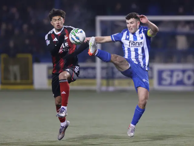 Finlay Thorndike challenges for the ball
