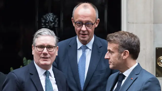 British Prime Minister Sir Keir Starmer, President of France Emmanuel Macron and German Chancellor Friedrich Merz standing outside 10 Downing Street after a meeting in London with President of Ukraine Volodymyr Zelenskyy