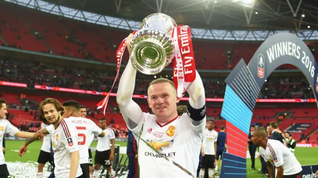 Wayne Rooney lifts the FA Cup