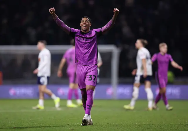 Wigan player celebrates at the full time whistle