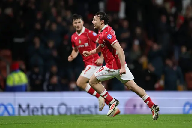 Rathbone runs to celebrate after scoring