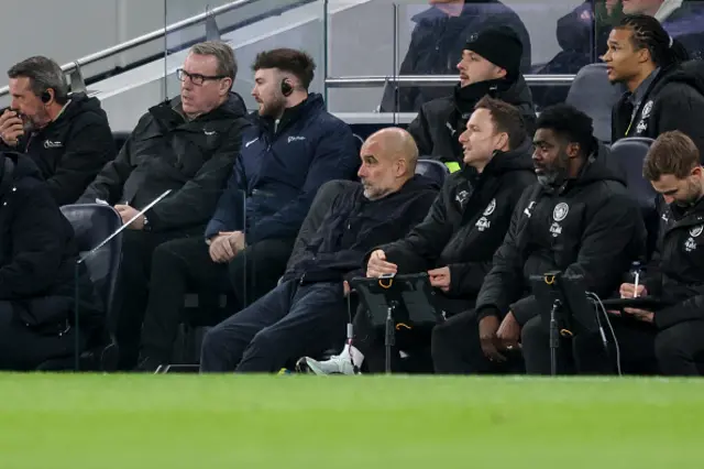 Head Coach Pep Guardiola of Manchester City looks on
