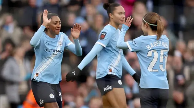 Kerolin Nicoli Israel Ferraz of Manchester City celebrates scoring her team's fourth goal with teammate Yui Hasegawa