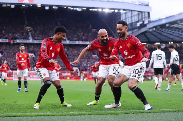 Matheus Cunha of Manchester United celebrates with Bryan Mbeumo of Manchester United (C) and Amad Diallo