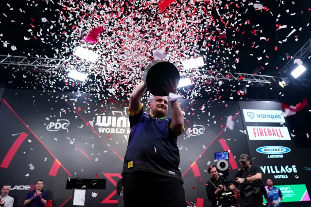 England's Luke Littler celebrates winning during day four of the Winmau World Masters at Arena MK, Milton Keynes