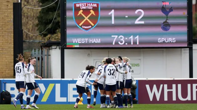 Olivia Holdt of Tottenham Hotspur (obscured) celebrates scoring her team's second goal with teammates