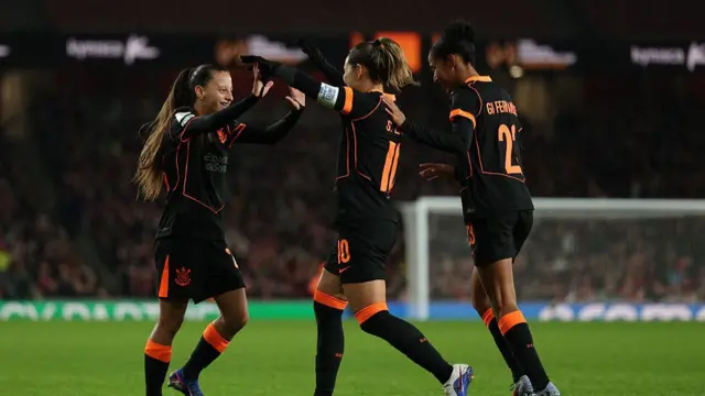 Corinthians' players celebrate their first goal