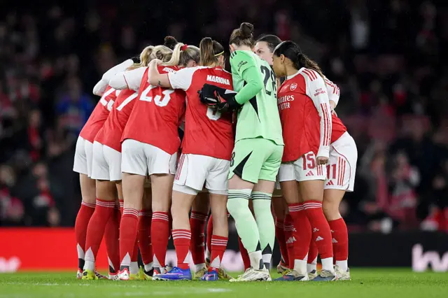 Players of Arsenal form a huddle
