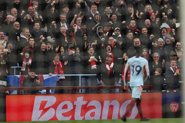 Brentford fans celebrate the opening goal
