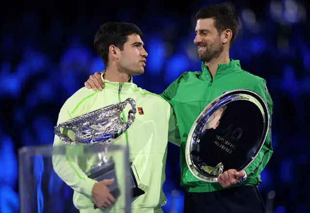 Carlos Alcaraz and Novak Djokovic with their trophies