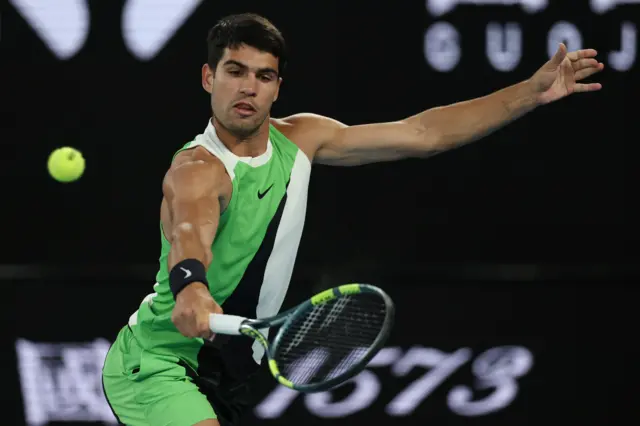 Carlos Alcaraz hits a backhand