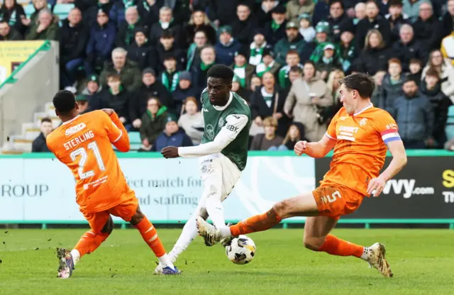 Elie Youan has a shot blocked by the Rangers defence