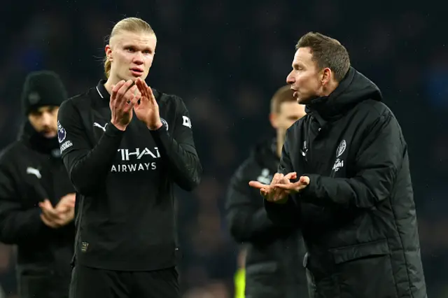 Manchester City assistant manager Pep Lijnders makes a point to Erling Haaland