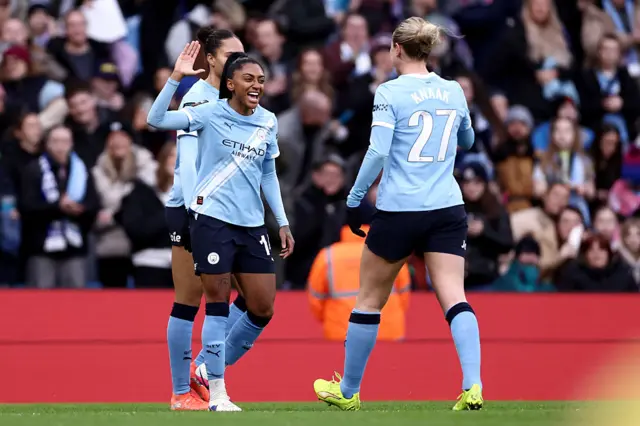 Kerolin Nicoli Israel Ferraz of Manchester City celebrates scoring her team's fourth goal with teammate Rebecca Knaak