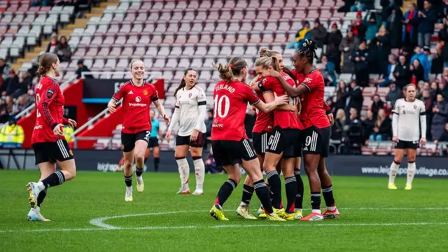 Lisa Naalsund of Manchester United celebrates scoring her teams second goal with teammates