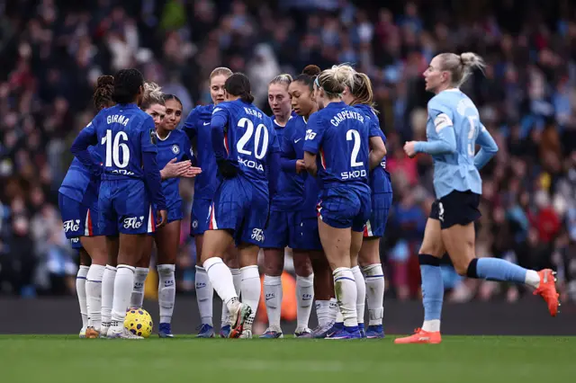 Players of Chelsea enter a huddle