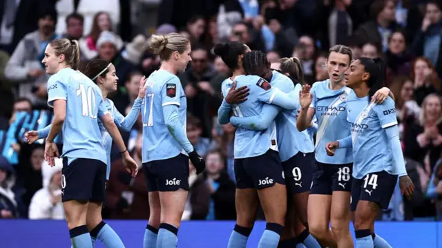 Bunny Shaw celebrates with teammates (third right)
