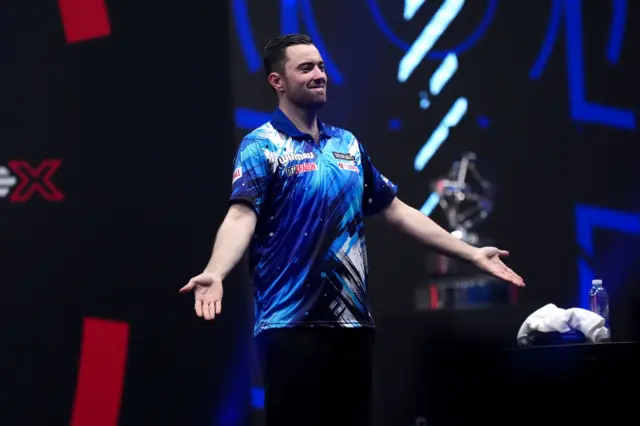 Luke Humphries celebrates his win over Gian van Veen