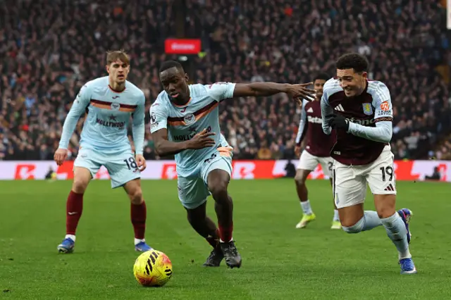 Michael Kayode (C) vies with Aston Villa's English defender Jadon Sancho