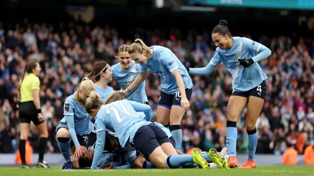Kerolin Nicoli Israel Ferraz of Manchester City celebrates scoring her team's third goal with teammates